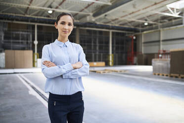 Portrait of confident businesswoman in a factory - BSZF01222