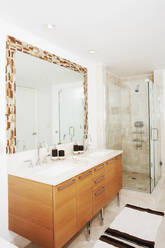 Mirror, sinks and shower in modern bathroom - BLEF13234