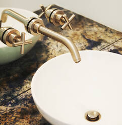 Close up of sink and faucet in modern bathroom - BLEF13246