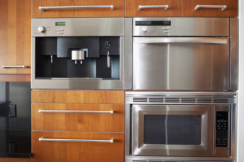 Ovens, microwave and cabinets in modern kitchen - BLEF13255