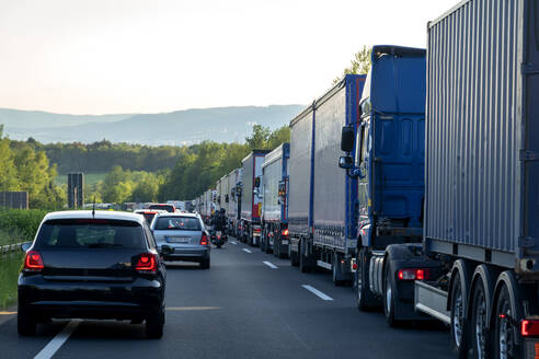 Rescue lane, cars and trucks during traffic jam in the evening, Germany - NDF00952