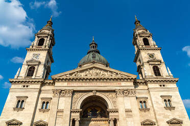 Low angle view of St. Stephen's Basilica against blue sky at Budapest, Hungary - SPCF00433