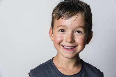 Portrait of strong boy, white background - MGIF00653