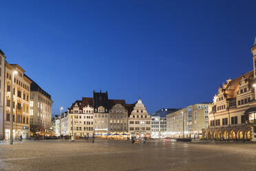 Town square amidst buildings against clear blue sky at night in Saxony, Germany - GWF06204