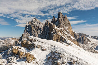 Idyllic shot of snow covered Seceda peak and mountains against sky, Italy - WPEF01673