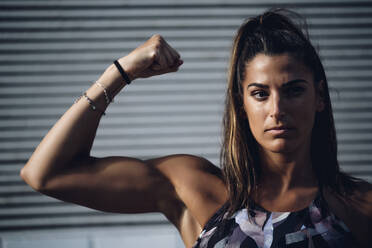Portrait of Young Fitness Woman Shows Biceps Stock Image - Image of  athlete, athletic: 59823083