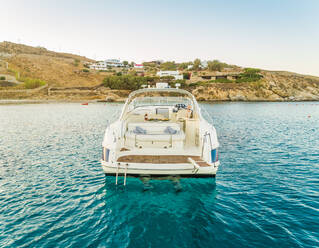 Close aerial view of luxurious yacht with catering, Mikonos island, Greece. - AAEF00189