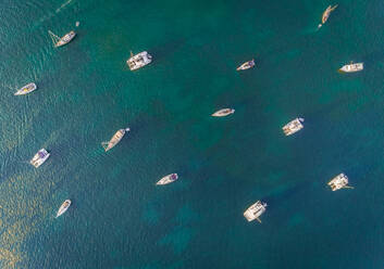 Aerial view above of group of boats anchored in the bay of Vathy Greece. - AAEF00259