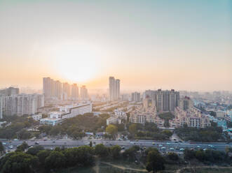 Aerial view of Sohna road overlooking a residential neighbourhood in sector 49 Gurgaon during golden hour in Delhi ncr, India. - AAEF00321