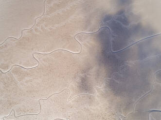 Aerial view above river creating an abstract pattern, Kachemak bay, Alaska. - AAEF00365