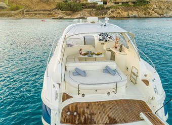 Close aerial view of luxurious yacht with catering, Mikonos island, Greece. - AAEF00489
