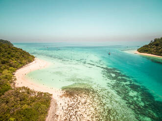 Aerial view of people swimming in sea on Koh Rok Yai island in Thailand. - AAEF01051