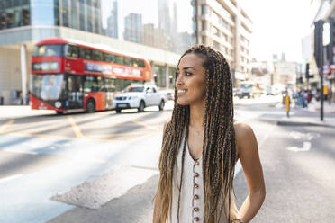 Portrait of smiling young woman in the city, London, UK - WPEF01709