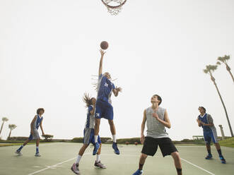 Basketball teams playing on court - BLEF13789