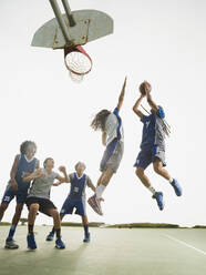 Basketball teams playing on court - BLEF13790