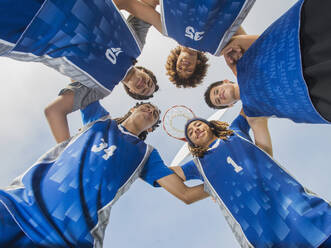 Basketball team smiling on court - BLEF13795