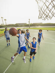 Basketball teams playing on court - BLEF13798