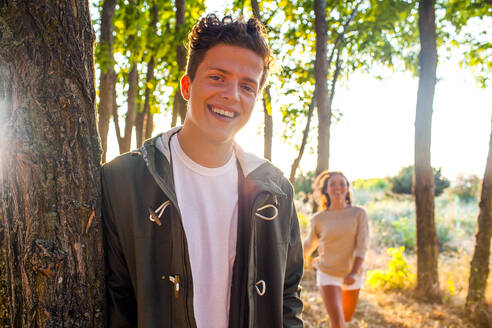 Caucasian man smiling with girlfriend in park - BLEF13841