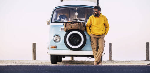 Mature man standing on van, Fuerteventura - SIPF02070