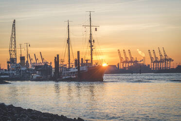 View of harbor against sky during sunrise at Hamburg, Germany - KEBF01267