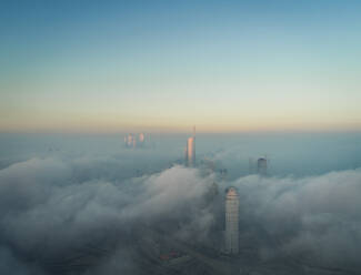 Aerial view of skyscrapers and Almas tower in the clouds of Dubai, U.A.E - AAEF01104