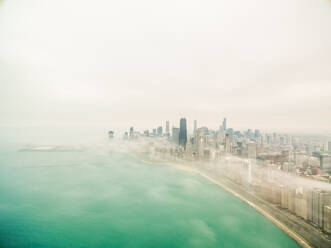 Aerial view of mist covering Chicago coastal line, USA. - AAEF01323