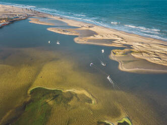 Aerial view of people kitesurfing on caiupe Lagoon in Brazil. - AAEF01464