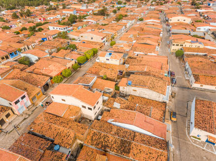 Aerial view of rooftops and small streets of Rio do Fogo town in Brazil. - AAEF01485