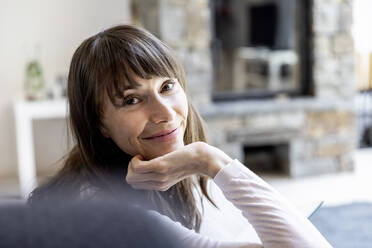 Portrait of smiling woman at home - FMKF05832