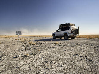 Off-road vehicle driving on a dirt road, Makgadikgadi Pans, Botswana - VEGF00486
