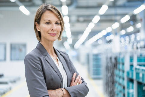 Portrait of a confident businesswoman in a modern factory stock photo