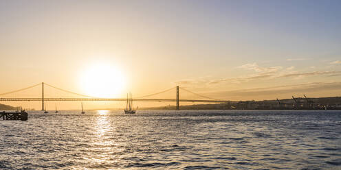 April 25th Bridge over Tagus river against sky during sunset in Lisbon, Portugal - WDF05386