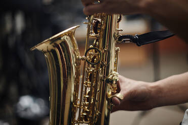 Close up of Caucasian man playing saxophone - BLEF13908