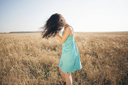 Caucasian woman standing in rural field - BLEF13914