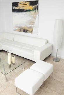 Ottomans, coffee table and sofa in modern living room - BLEF13947