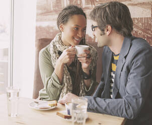 Couple drinking coffee in cafe - BLEF14034