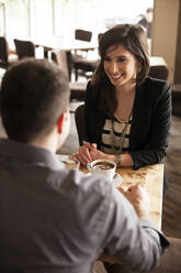 Couple drinking coffee in cafe - BLEF14046