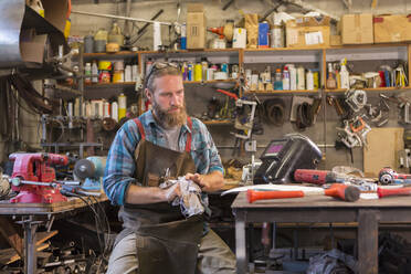 Caucasian craftsman working in workshop - BLEF14202