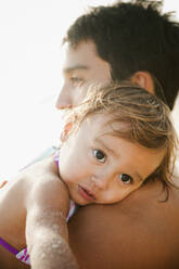 Mixed race father comforting daughter - BLEF14264