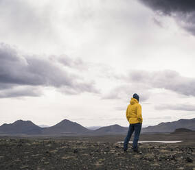 Mature man looking at view, Highland region, Iceland - UUF18764