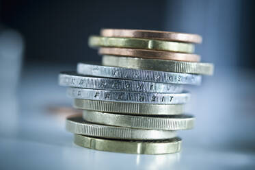 Stack of euro coins with inscriptions 'Unity', 'Law' and 'Freedom' - ASF06475