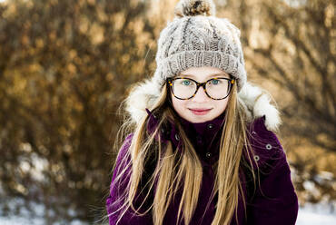 Caucasian girl smiling outdoors in winter - BLEF14368