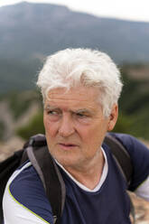 Portrait of senior hiker looking around - AFVF03806