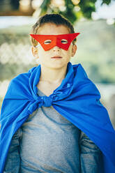 Caucasian boy wearing superhero costume - BLEF14604