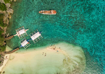 Aerial view of beach, pump boats and fishing vessel in Oslob, Philippines. - AAEF01787