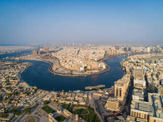 Aerial view of navigable river crossing suburbs, Dubai, U.A.E. - AAEF01891