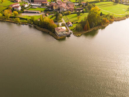 Aerial view of small village near lake, Civate, Italy. - AAEF01916