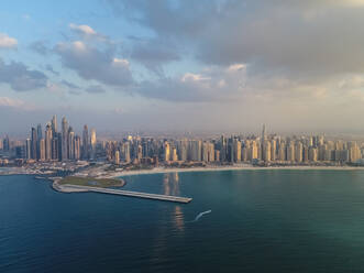 Aerial panoramic view of skyscrapers and bay of Dubai, United Arab Emirates. - AAEF01991