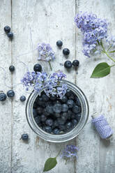 Directly above shot of blueberries in jar on wooden table - ASF06481