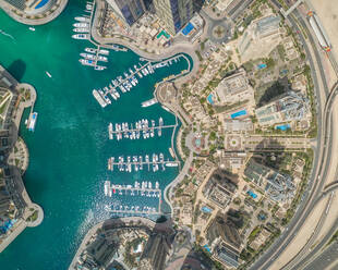 Aerial view of Dubai Marina with moored boats and skyscrapers, UAE. - AAEF02336